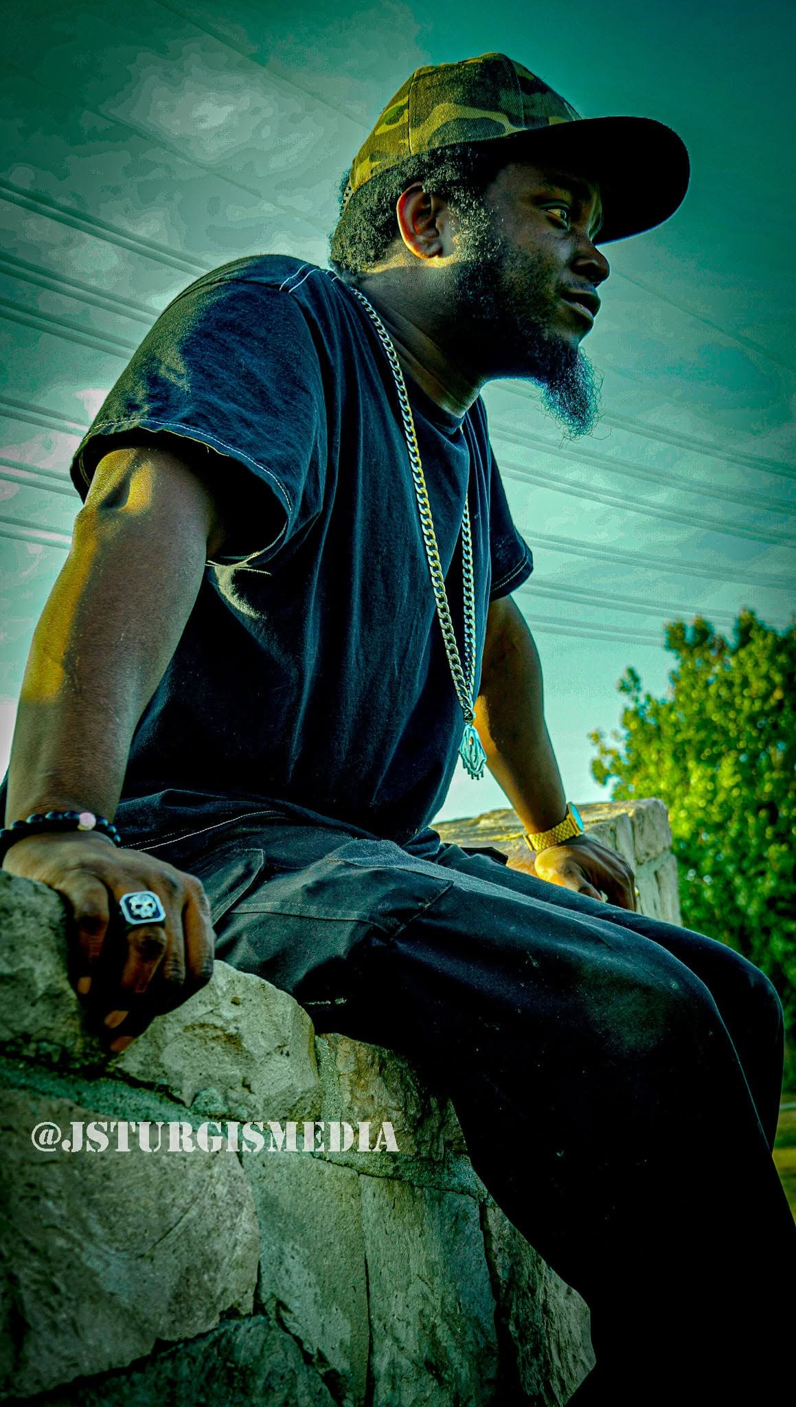 Dramatic outdoor artist portrait by J Sturgis Media