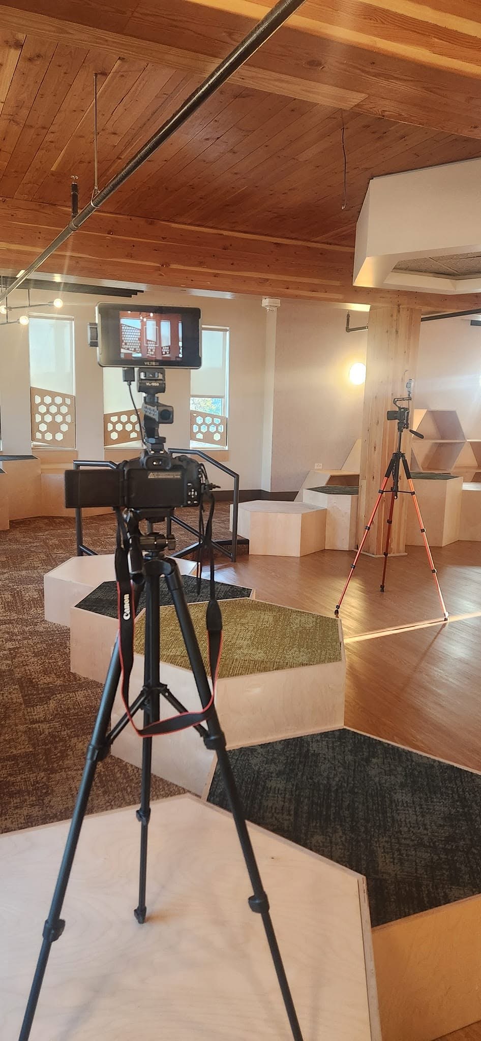 Camera and lighting setup prepared for an indoor J Sturgis Media production